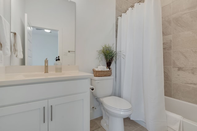 full bathroom with shower / tub combo, vanity, and toilet