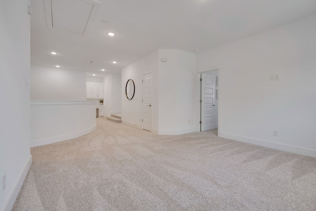 unfurnished room with light carpet