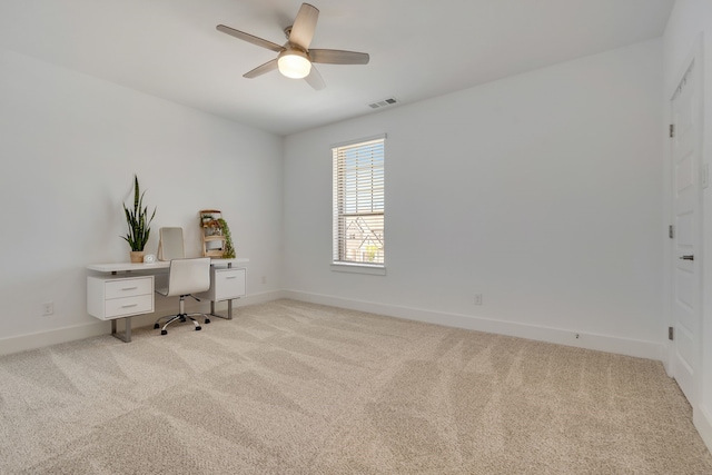 carpeted home office with ceiling fan