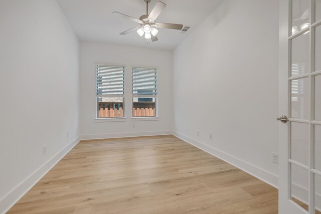 unfurnished room featuring light hardwood / wood-style flooring and ceiling fan