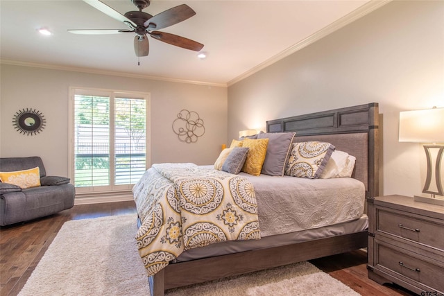 bedroom with ceiling fan, dark hardwood / wood-style flooring, and ornamental molding