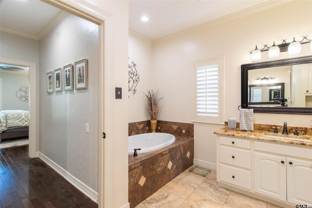 bathroom featuring vanity, a relaxing tiled tub, and crown molding