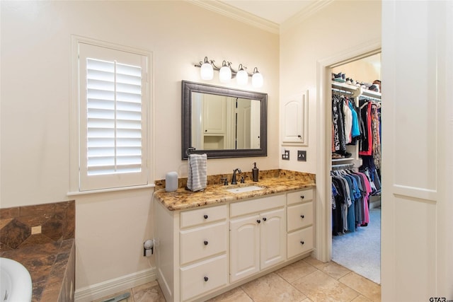 bathroom with tile patterned flooring, vanity, and ornamental molding