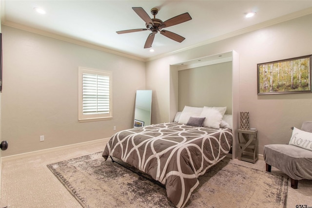 bedroom with carpet, ceiling fan, and crown molding