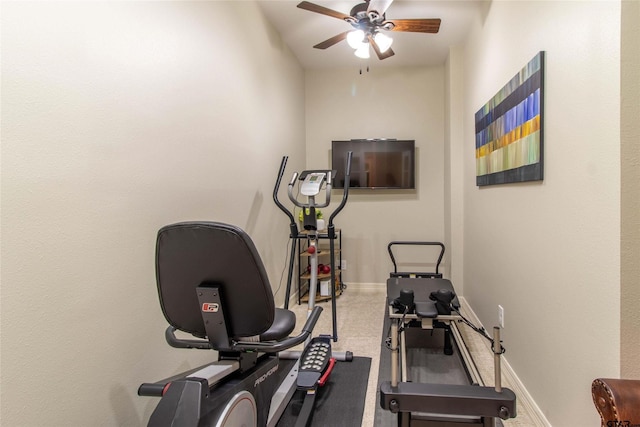 exercise room with ceiling fan