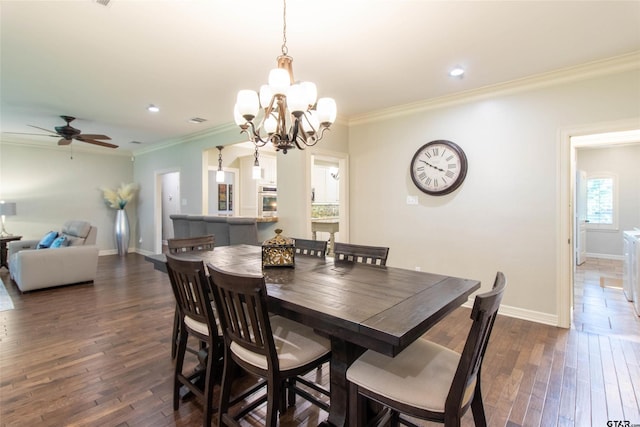 dining space with ceiling fan with notable chandelier, dark hardwood / wood-style floors, and crown molding