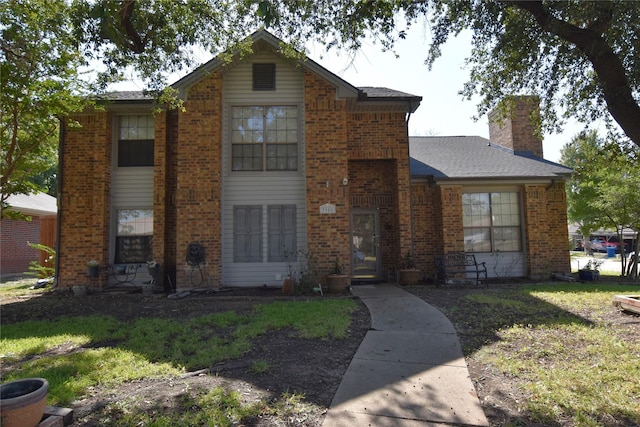 view of property with a front lawn