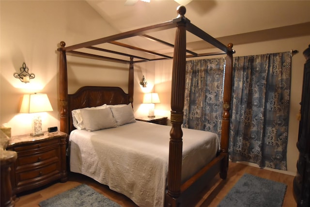 bedroom with wood-type flooring and ceiling fan