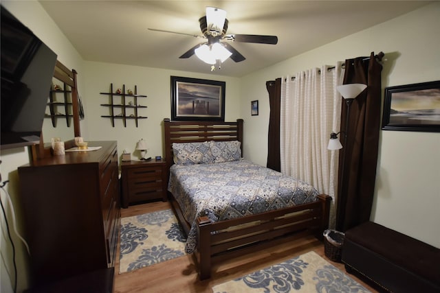 bedroom featuring wood-type flooring and ceiling fan