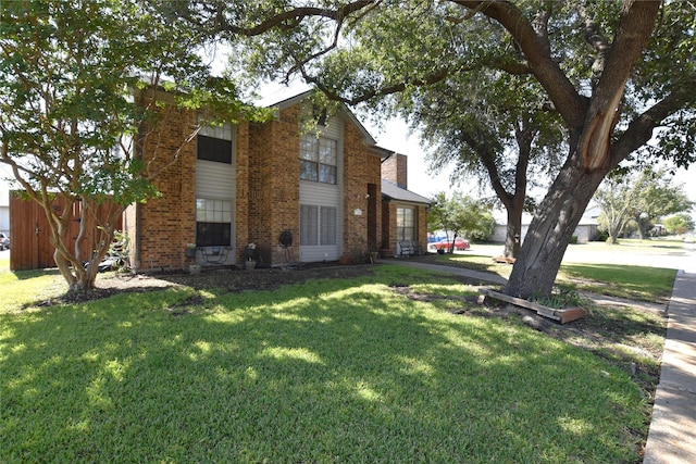 view of property exterior featuring a lawn