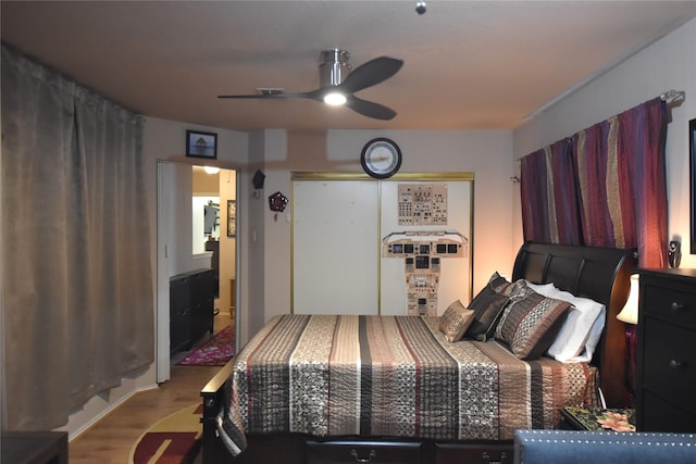 bedroom featuring ceiling fan and light wood-type flooring