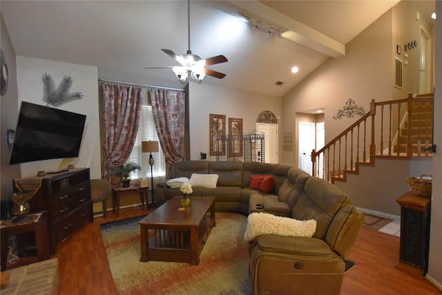 living room with vaulted ceiling with beams, ceiling fan, and hardwood / wood-style flooring