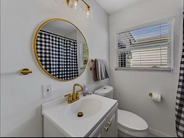 bathroom with vanity and toilet