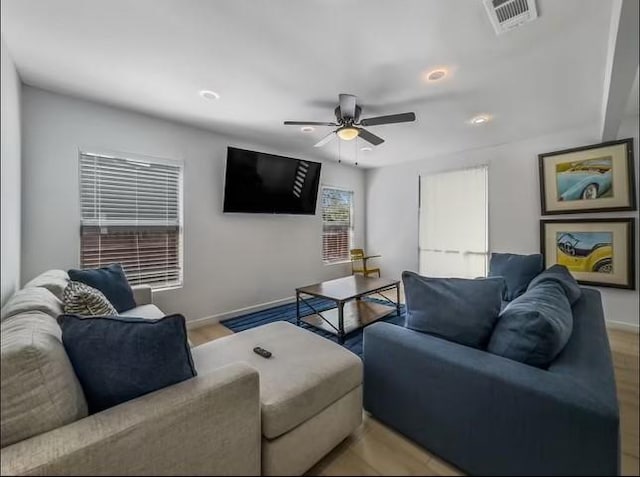 living room featuring ceiling fan