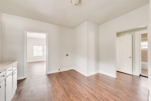 unfurnished room with hardwood / wood-style floors