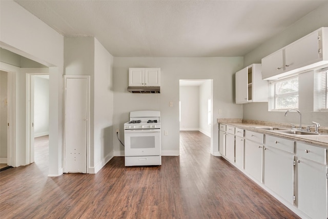 kitchen with white cabinets, dark hardwood / wood-style flooring, white range with gas cooktop, and sink