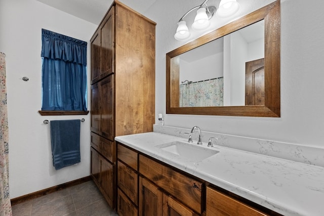 bathroom with vanity and tile patterned flooring