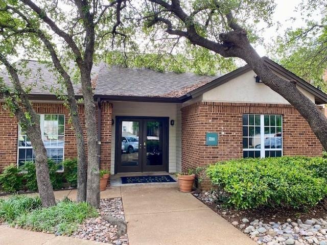 property entrance featuring french doors