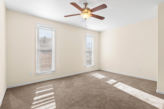 empty room featuring carpet floors and ceiling fan