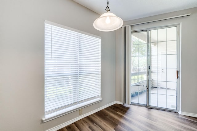 unfurnished dining area featuring hardwood / wood-style flooring