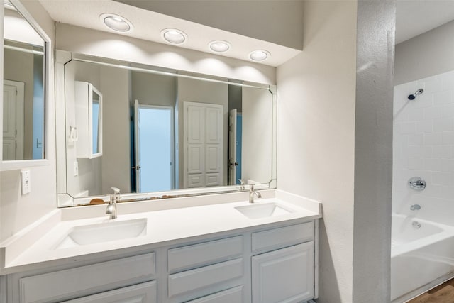 bathroom with vanity and bathing tub / shower combination