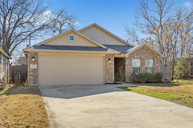 view of front of home featuring a front yard and a garage