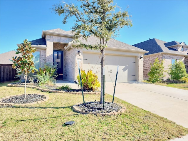 view of front of house with a garage and a front lawn