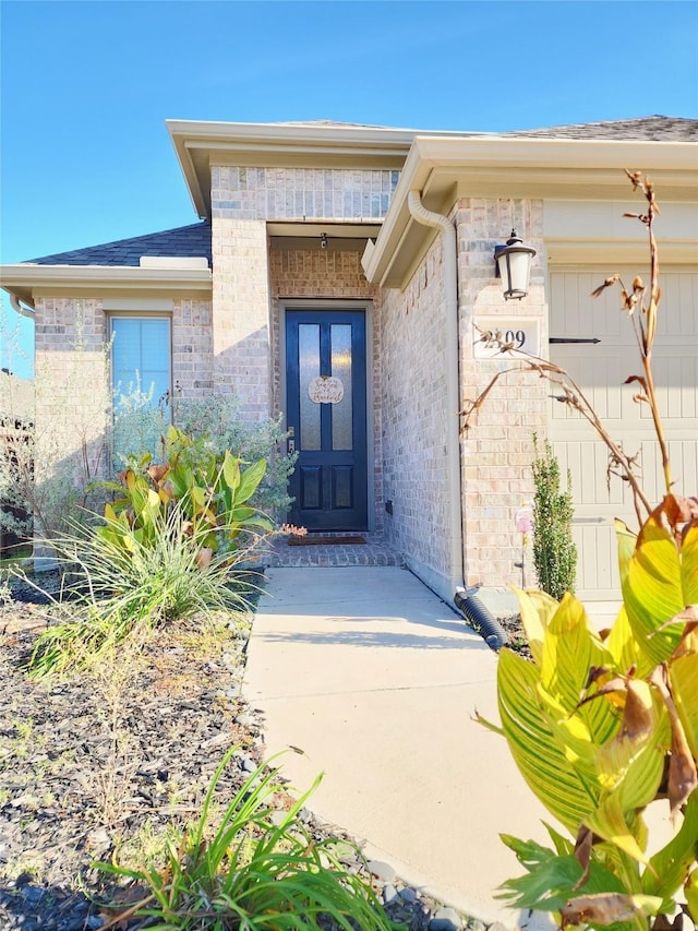 entrance to property featuring a garage