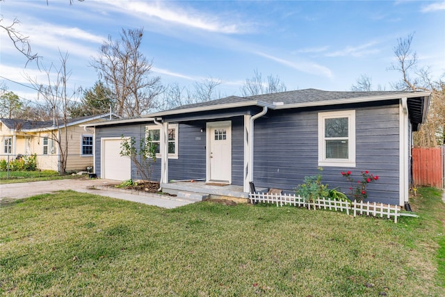 ranch-style house with a front yard and a garage