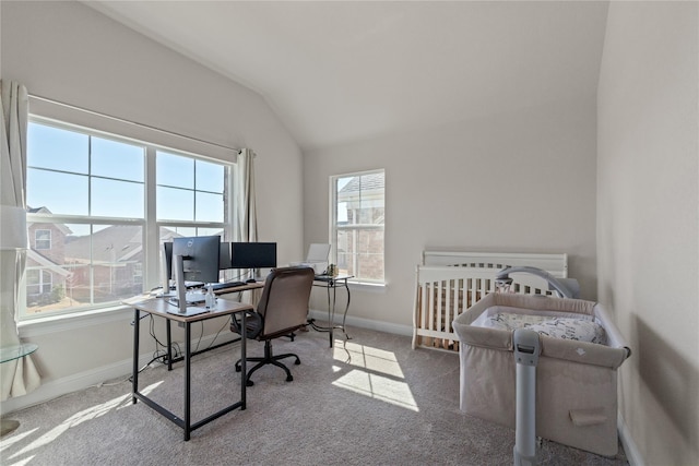 carpeted office with vaulted ceiling