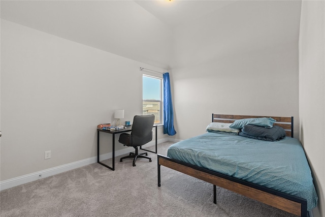 carpeted bedroom with vaulted ceiling