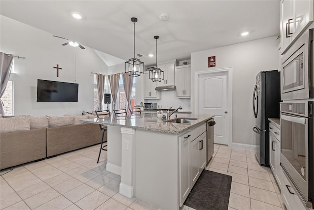 kitchen with white cabinets, an island with sink, stainless steel appliances, and sink