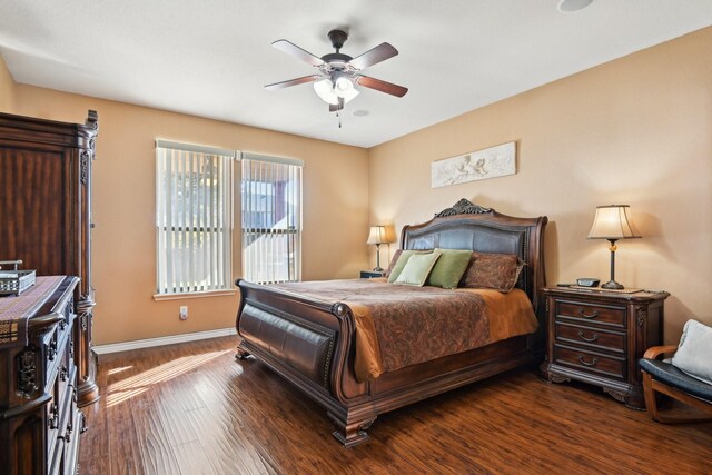 bedroom with dark wood-type flooring and ceiling fan