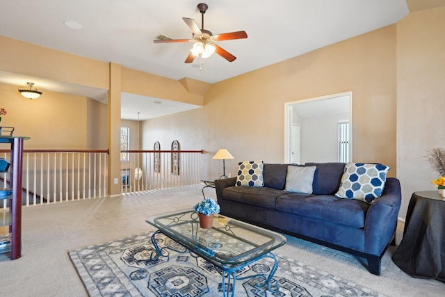 carpeted living room featuring ceiling fan