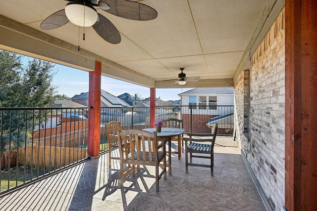 view of patio / terrace featuring ceiling fan and a balcony