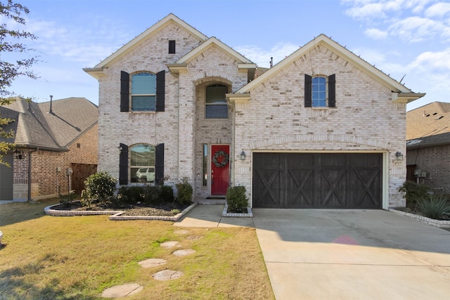 french country inspired facade featuring a garage and a front lawn