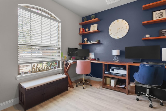 office area featuring light wood-type flooring and a wealth of natural light