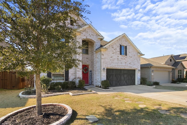 view of front of property with a front lawn and a garage