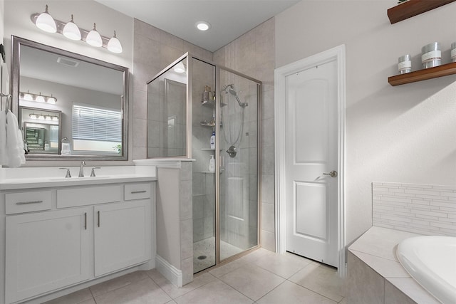 bathroom with separate shower and tub, vanity, and tile patterned floors