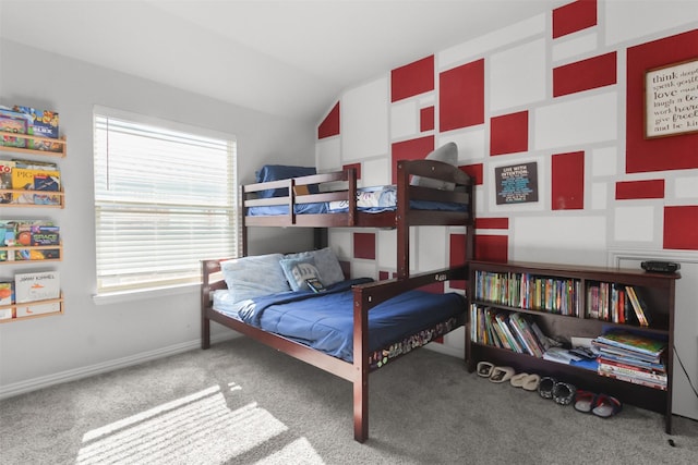 bedroom with multiple windows, lofted ceiling, and carpet flooring