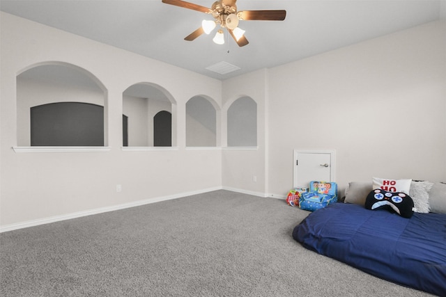 interior space featuring ceiling fan and carpet flooring