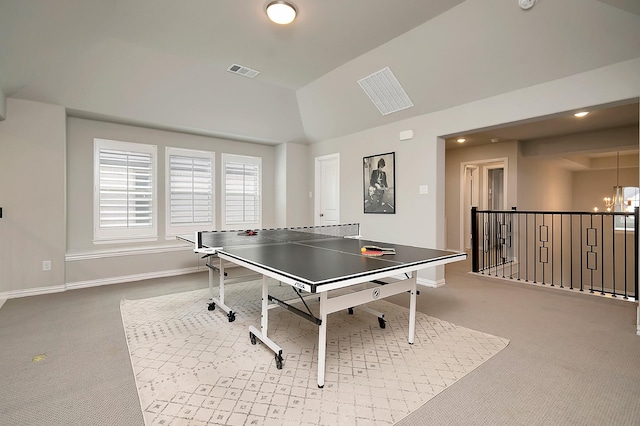 rec room with light carpet, vaulted ceiling, and a notable chandelier