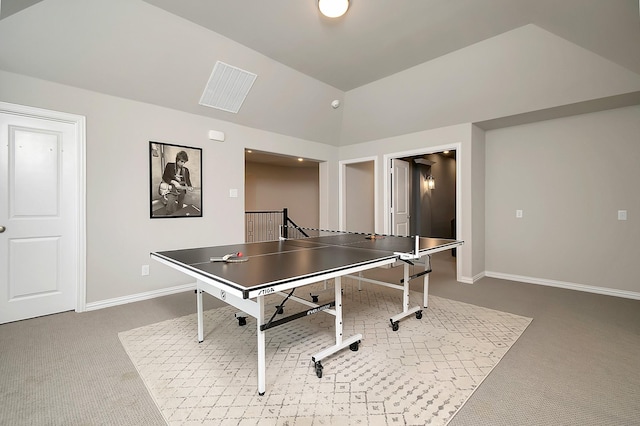 rec room featuring carpet flooring and vaulted ceiling