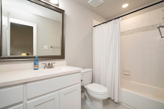 full bathroom featuring shower / bath combo, vanity, toilet, and tile patterned floors