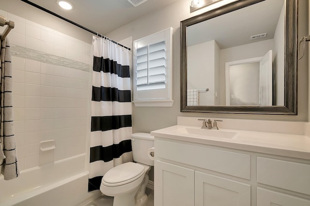 full bathroom with shower / bath combo with shower curtain, vanity, and toilet