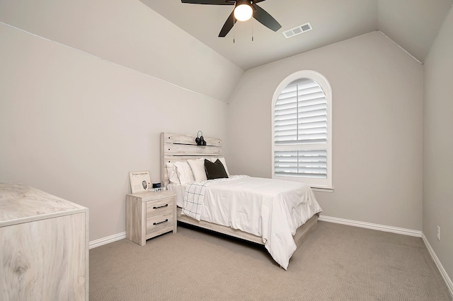 carpeted bedroom with vaulted ceiling and ceiling fan