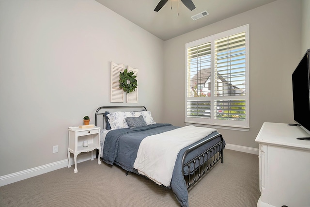 bedroom featuring light colored carpet and ceiling fan