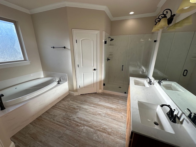 bathroom with shower with separate bathtub, vanity, and crown molding