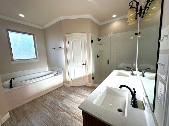 bathroom with independent shower and bath, crown molding, vanity, and wood-type flooring