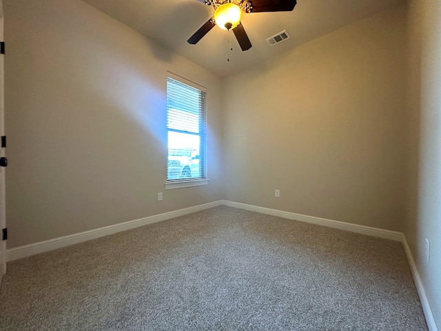 spare room with carpet flooring and ceiling fan